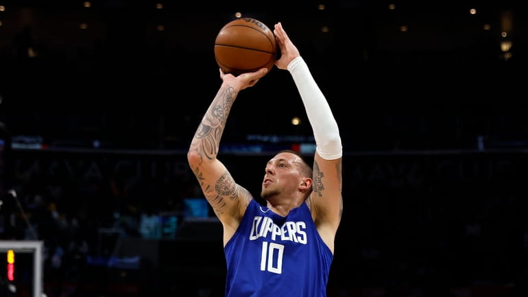 Los Angeles Clippers' Daniel Theis looks to shoot a 3-point...