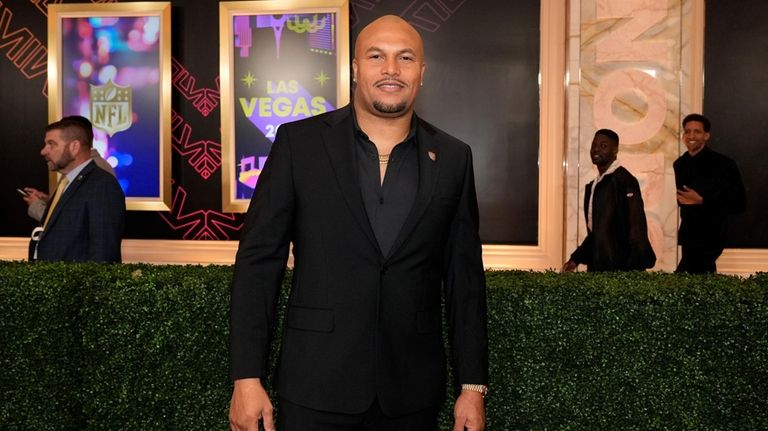 Las Vegas Raiders head coach Antonio Pierce poses on the...