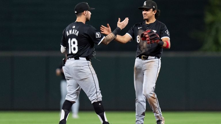 Chicago White Sox shortstop Jacob Amaya (18) and second baseman...