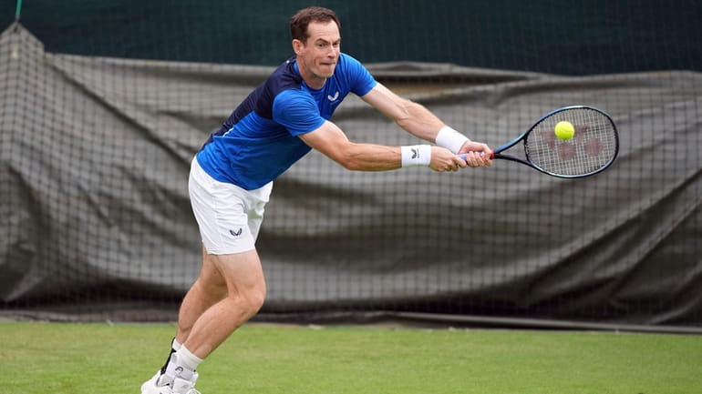 Andy Murray plays a shot during a training session on...
