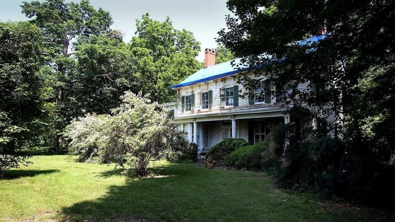 A file photo of the farmhouse and outlying structures on...