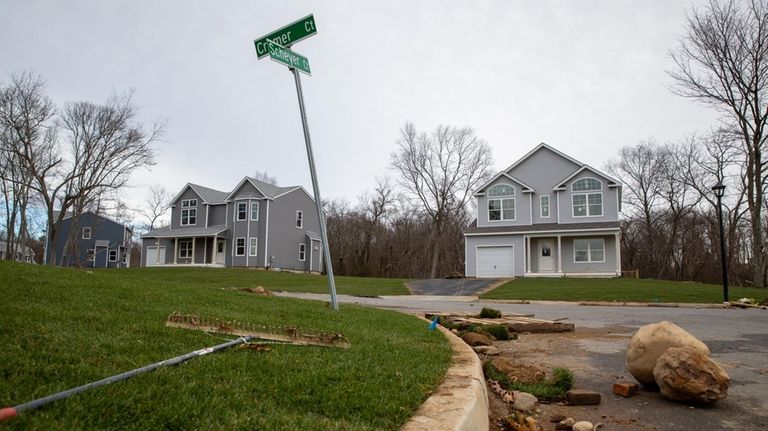 Finishing touches are added to new houses in the subdivision...