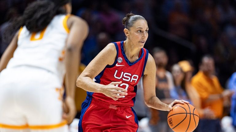 Team USA guard Diana Taurasi (12) brings the ball up...