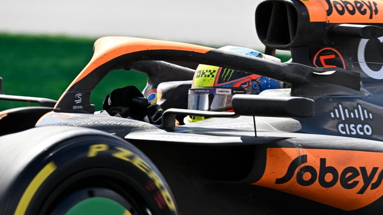 McLaren driver Oscar Piastri, of Australia, steers his car at...