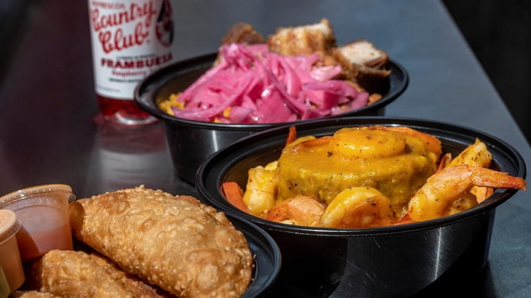 Punta Cana Dominican Grill serves empanadas, Mofongo and fried pork belly bowl.