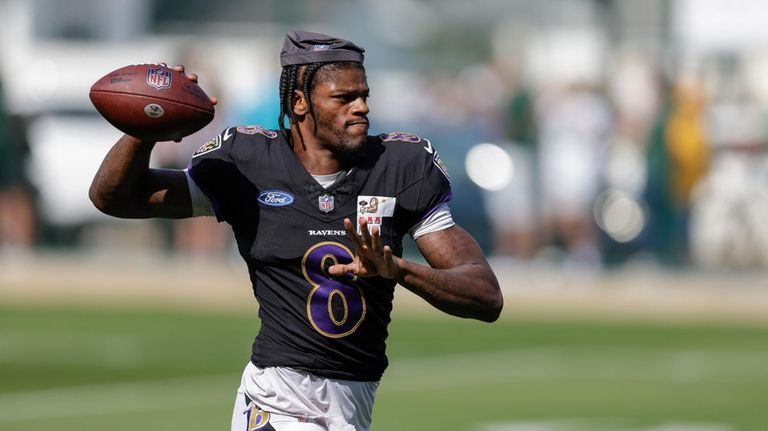 Baltimore Ravens quarterback Lamar Jackson throws a pass during an...