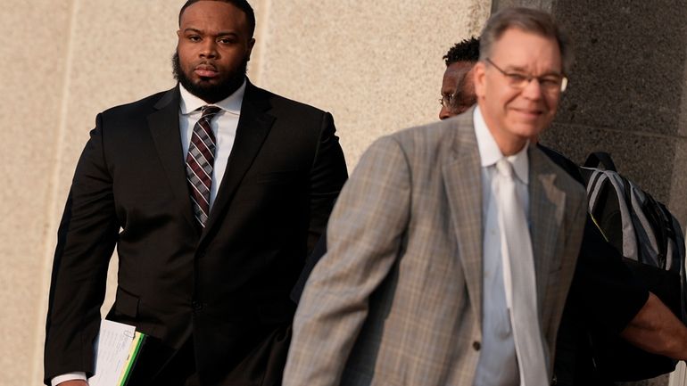 Former Memphis police officer Demetrius Haley, left, leaves the federal...