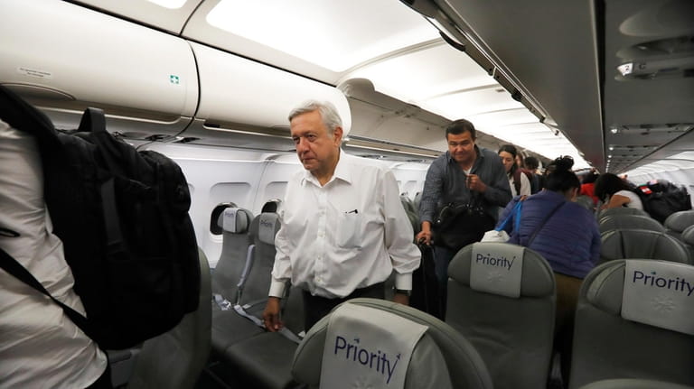 Mexican President Andres Manuel Lopez Obrador deplanes after traveling in...