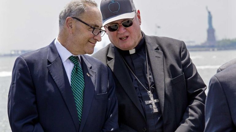 New York Cardinal Timothy Dolan speaks with Sen. Chuck Schumer...