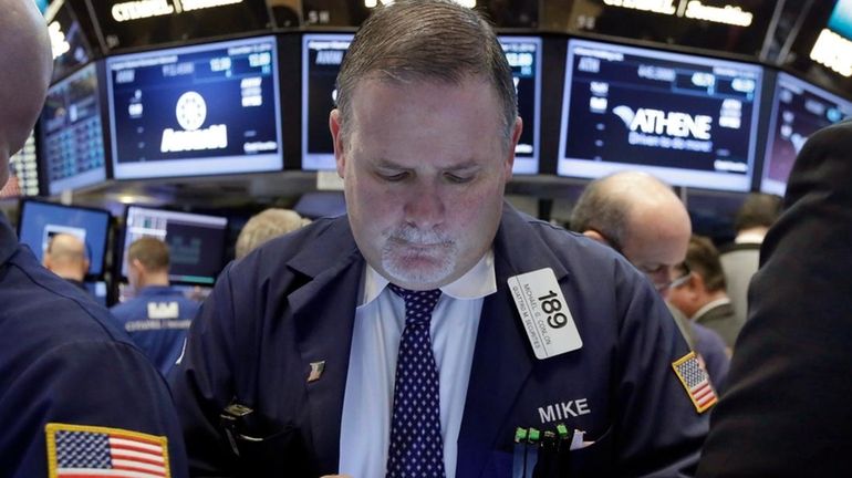 Trader Michael Conlon works on the floor of the New...