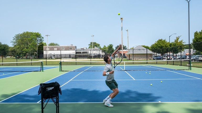 Mischa Retman of East Hampton practices on newly renovated tennis courts...