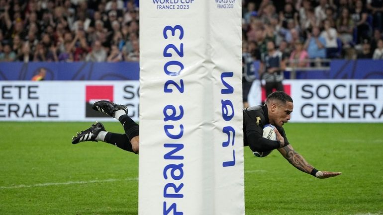 New Zealand's Aaron Smith scores a try during the Rugby...