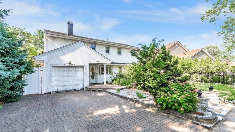 Priced at $895,000, this Colonial on Rosedale Road has a...