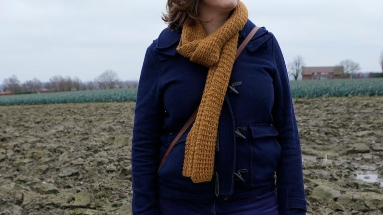 Biological engineer and environmentalist Ineke Maes stands in a field...