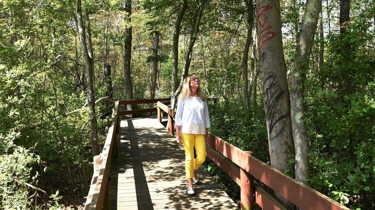 Suffolk County legislator Kara Hahn, walks along a path at...