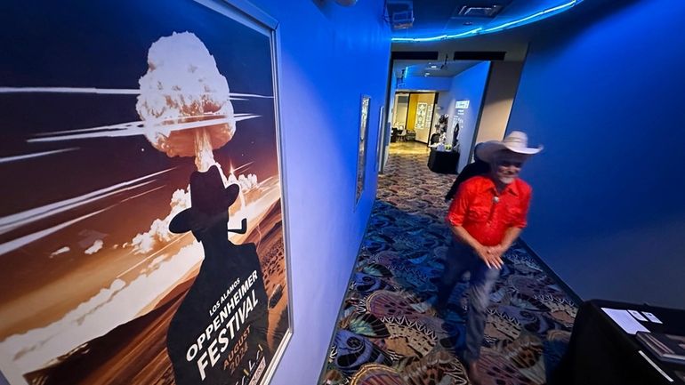 Downwinder Paul Pino heads through the SALA Event Center toward...