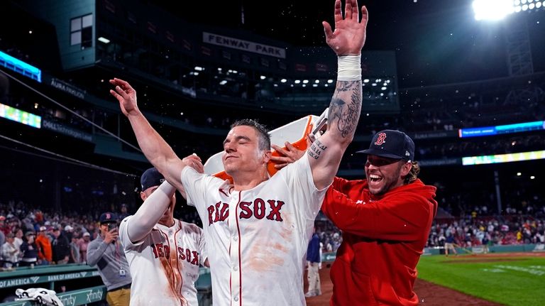 Boston Red Sox's Tyler O'Neill celebrates after his game-winning three-run...