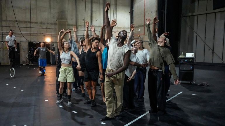 Dancers rehearse for "Dance of the Games" at the concert...