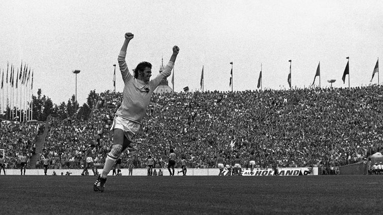 Dutch goalkeeper Jan Jongbloed, rejoicing after his teammate Johnny Rep,...