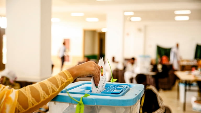 A woman casts her ballot during the presidential election, in...