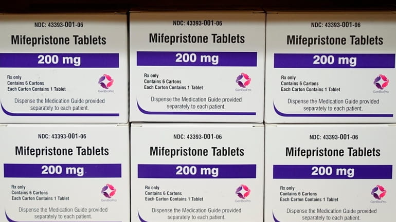 Boxes of the drug mifepristone sit on a shelf at...