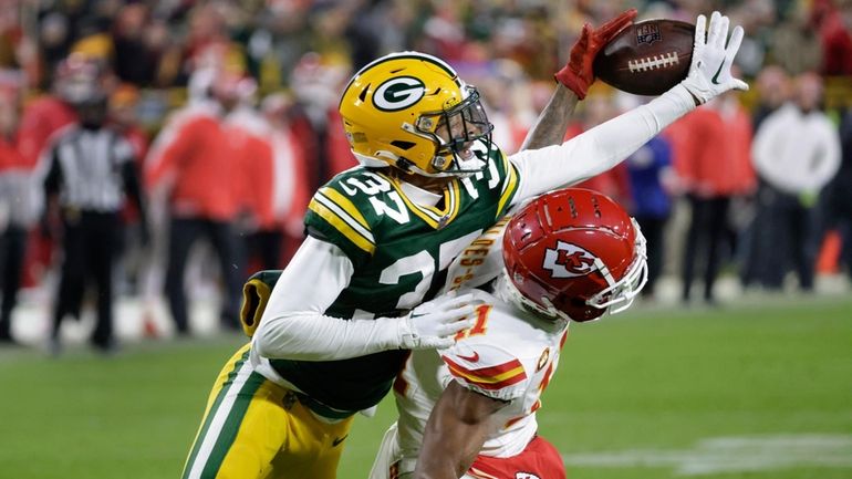 Green Bay Packers cornerback Carrington Valentine (37) breaks up a...