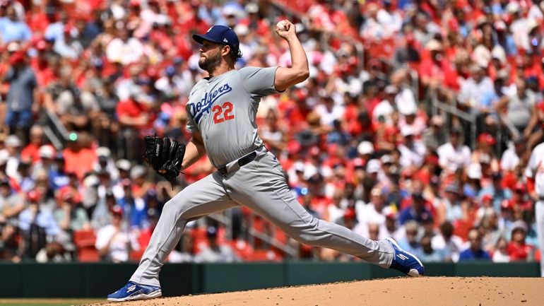 Los Angeles Dodgers starting pitcher Clayton Kershaw throws against the...