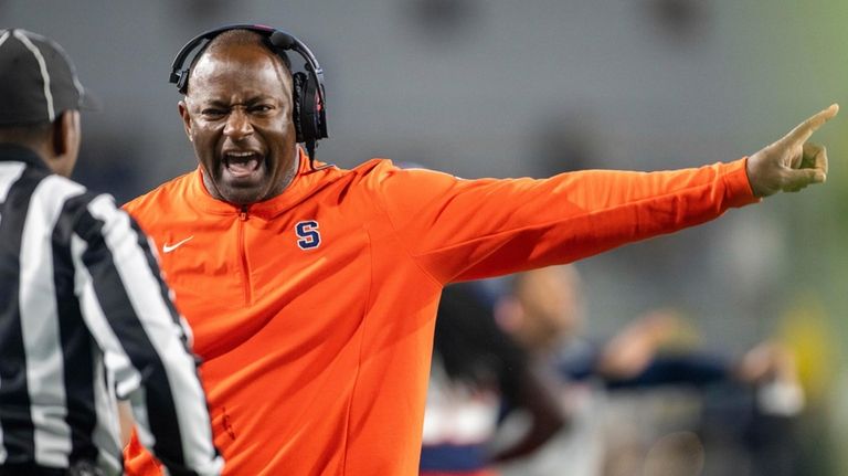 Syracuse coach Dino Babers yells to an official during the...