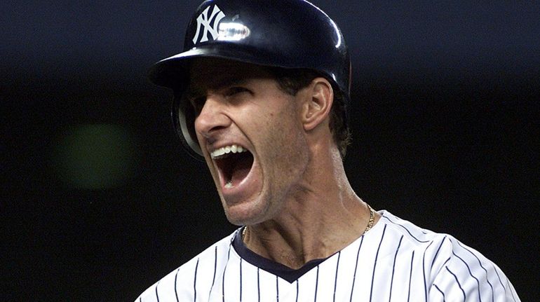 The Yankees' Paul O'Neill yells in the third inning of...