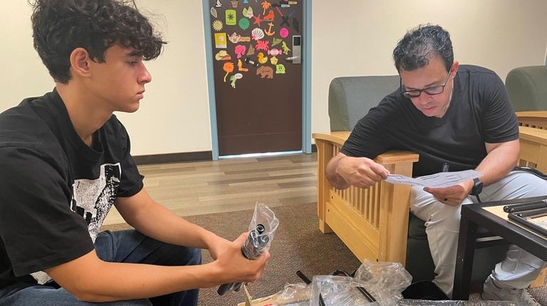 Angelo Lora, of Northern Westchester, and his son, Alexander, 15,...