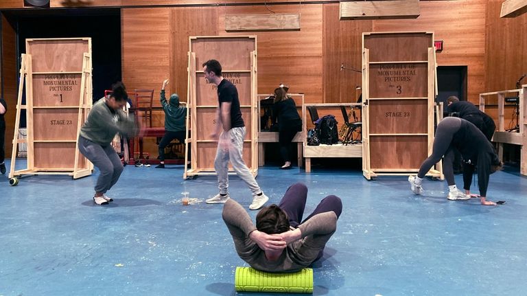 Actors warm up at the Weston Theater Company before performing...