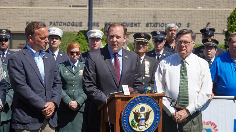 Former Rep. Lee Zeldin, center, with Brookhaven Town Supervisor Ed...