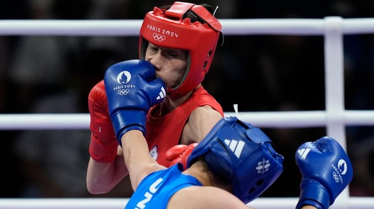 Uzbekistan's Sitora Turdibekova hits Taiwan's Lin Yu-ting in their women's...