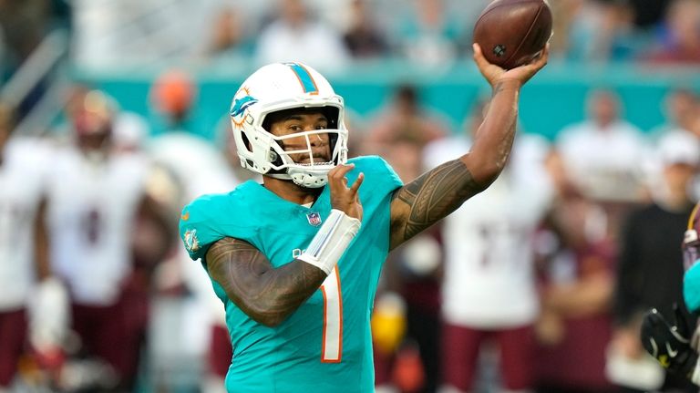 Miami Dolphins quarterback Tua Tagovailoa (1) throws during the first...