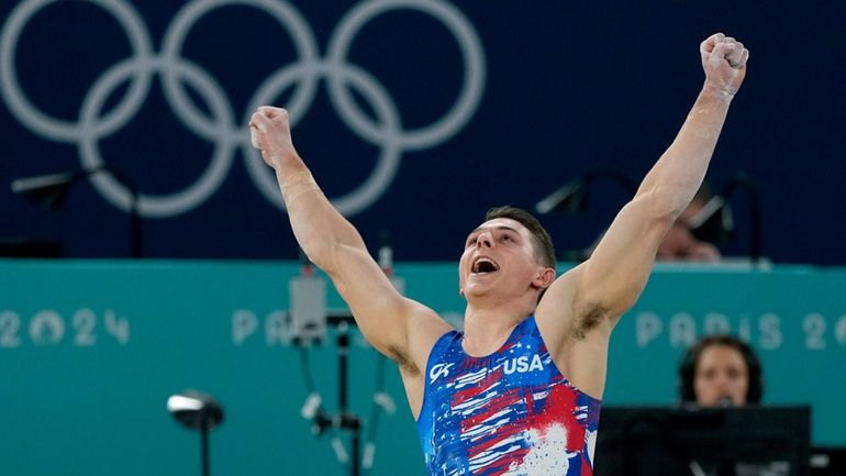 Paul Juda, of United States, celebrates after competing on the...