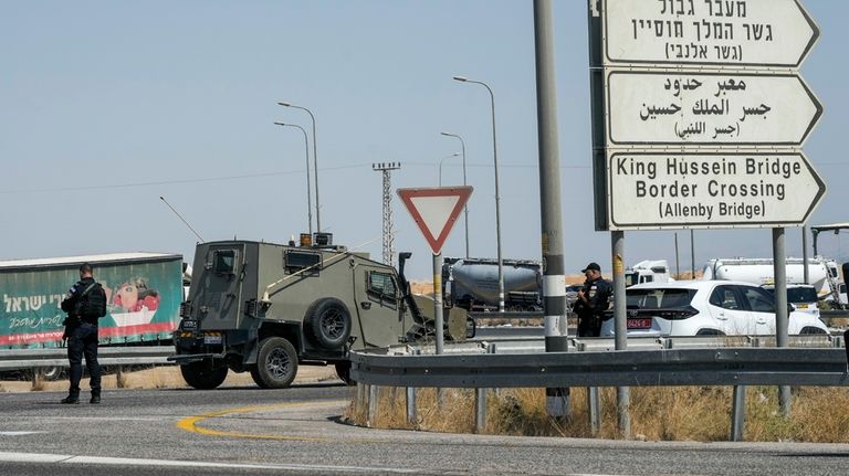 Israeli police stand guard near the site of a deadly...