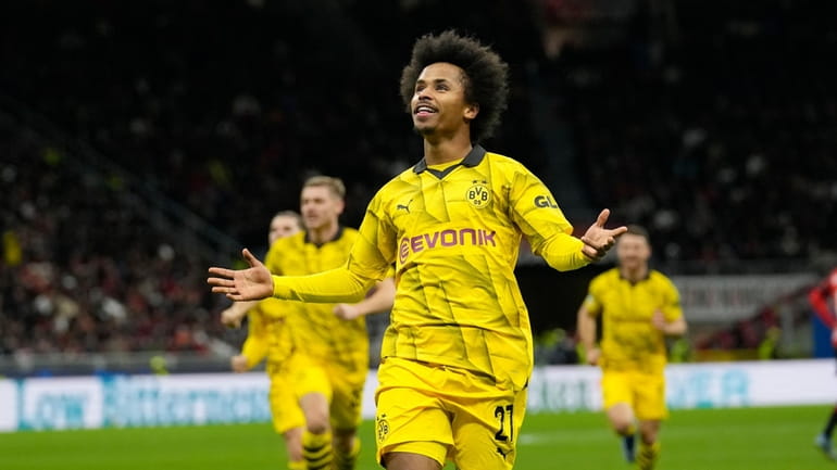 Dortmund's Karim Adeyemi celebrates after scoring his side's third goal...