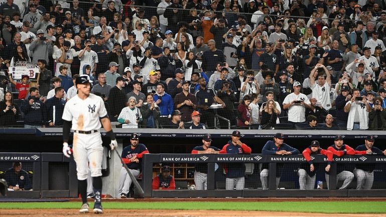 Fans stand as Yankees designated hitter Aaron Judge bats against...