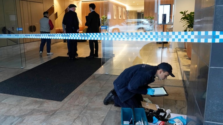 Police investigate vandalism at the U.S. consulate in Sydney, Monday,...