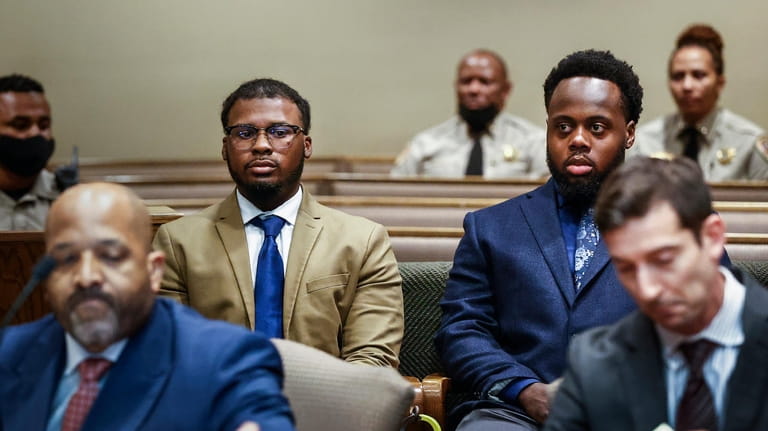 Former Memphis police officers Justin Smith, center left, and Tadarrius...