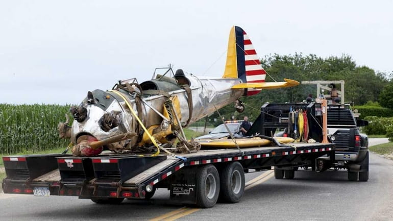 The wreckage of a small plane that crashed into a...
