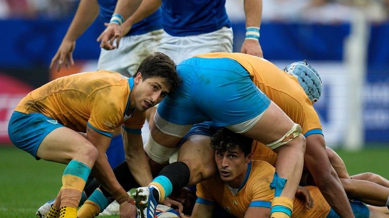 Uruguay's Santiago Arata lines up a pass during the Rugby...