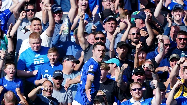 Everton's Michael Keane celebrates scoring during the English Premier League...