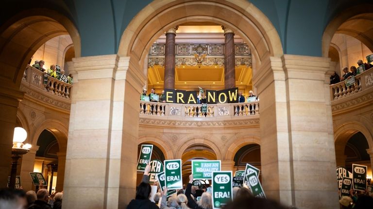 Crowds gather in the rotunda of the Minnesota State Capitol...