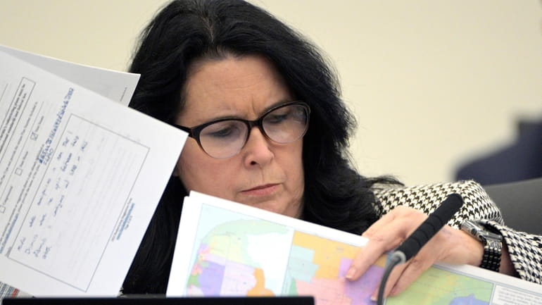 State Sen. Kelli Stargel looks through redistricting maps during a...