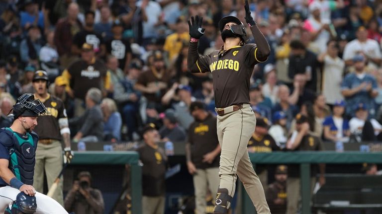 San Diego Padres' Fernando Tatis Jr. celebrates at home after...