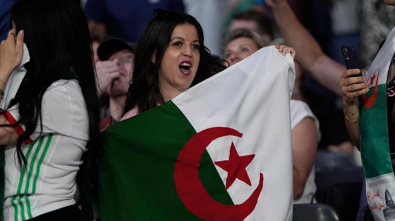 Fans cheer before Algeria's Imane Khelif and Hungary's Anna Hamori...