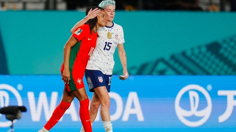 United States' Megan Rapinoe embraces Portugal's Jessica Silva, left, following...