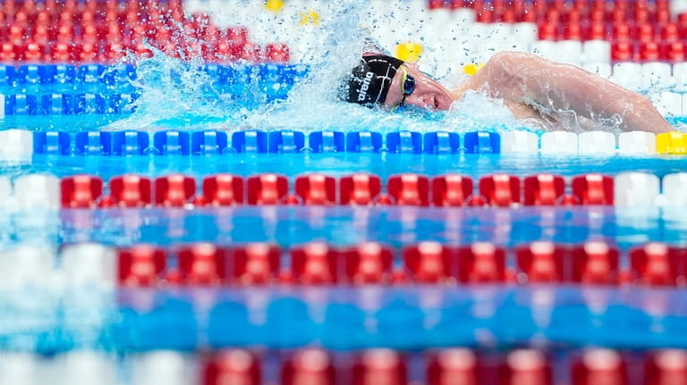 Luke Whitlock swims during a Men's 800 freestyle preliminary heat...