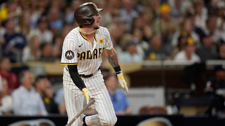 San Diego Padres' Jackson Merrill watches his three-RBI double during...